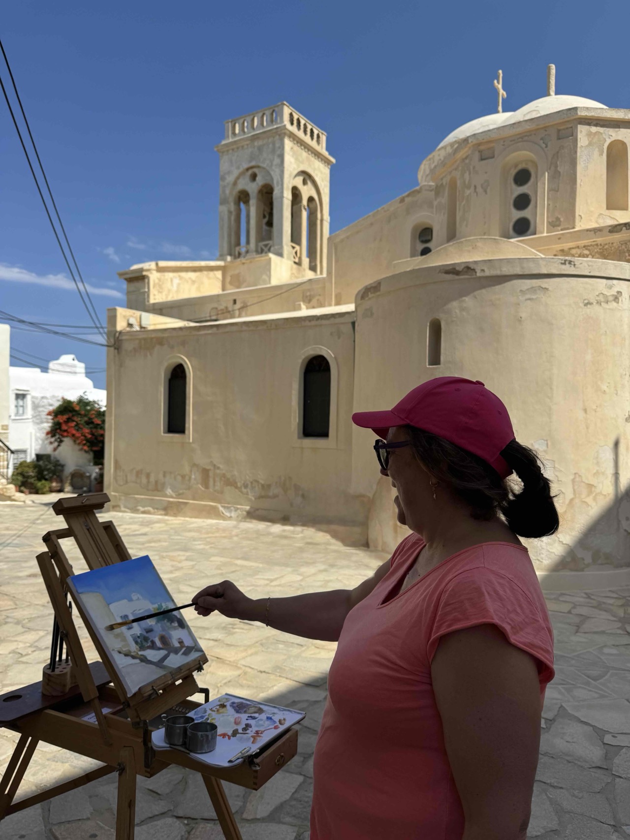 Artist painting the Catholic Church of Naxos