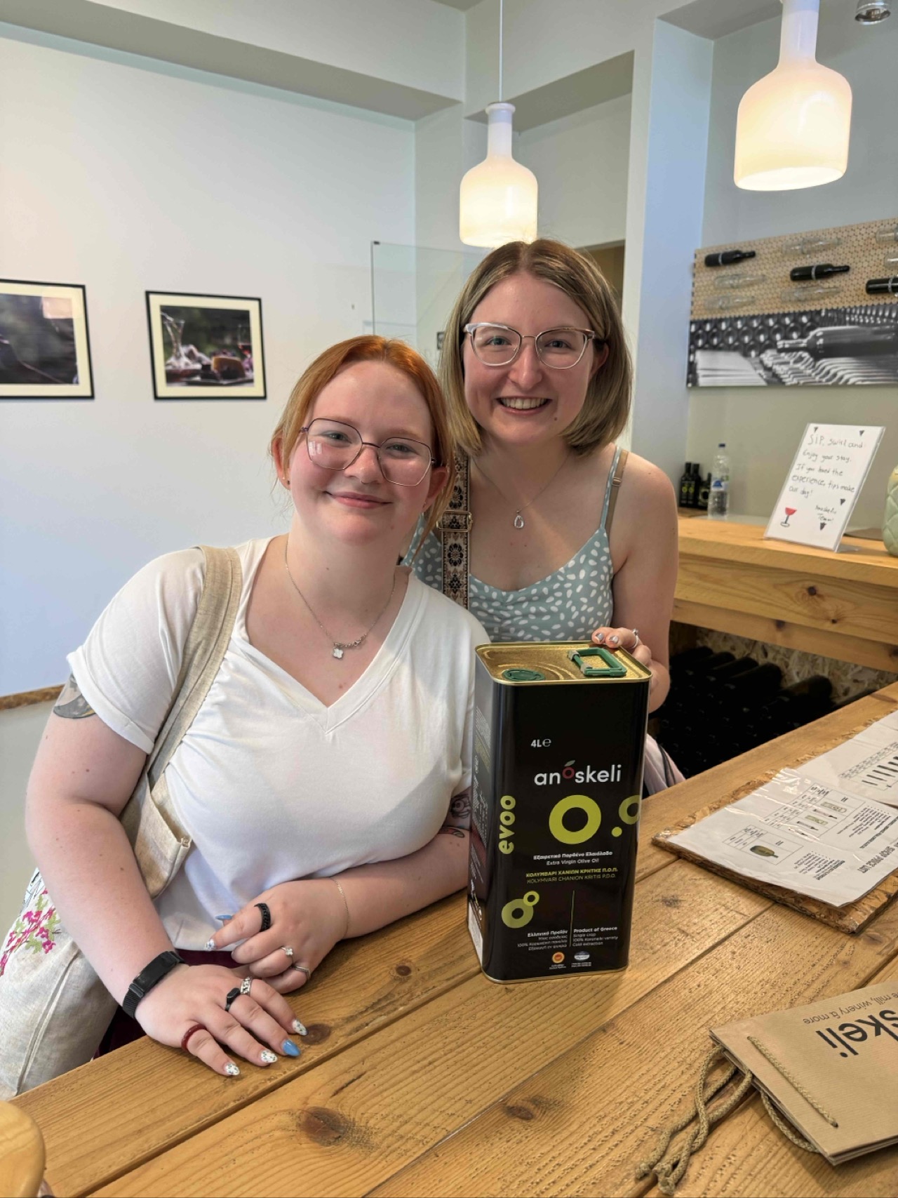 Jenna and Malorie purchasing a 4 kilo olive oil souvenir