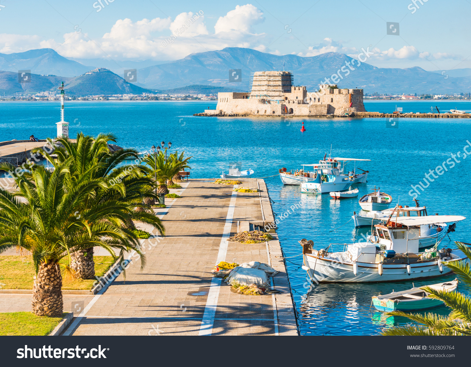 The Venetian harbor at golden hour, looking back at the Bourtzi fortress.